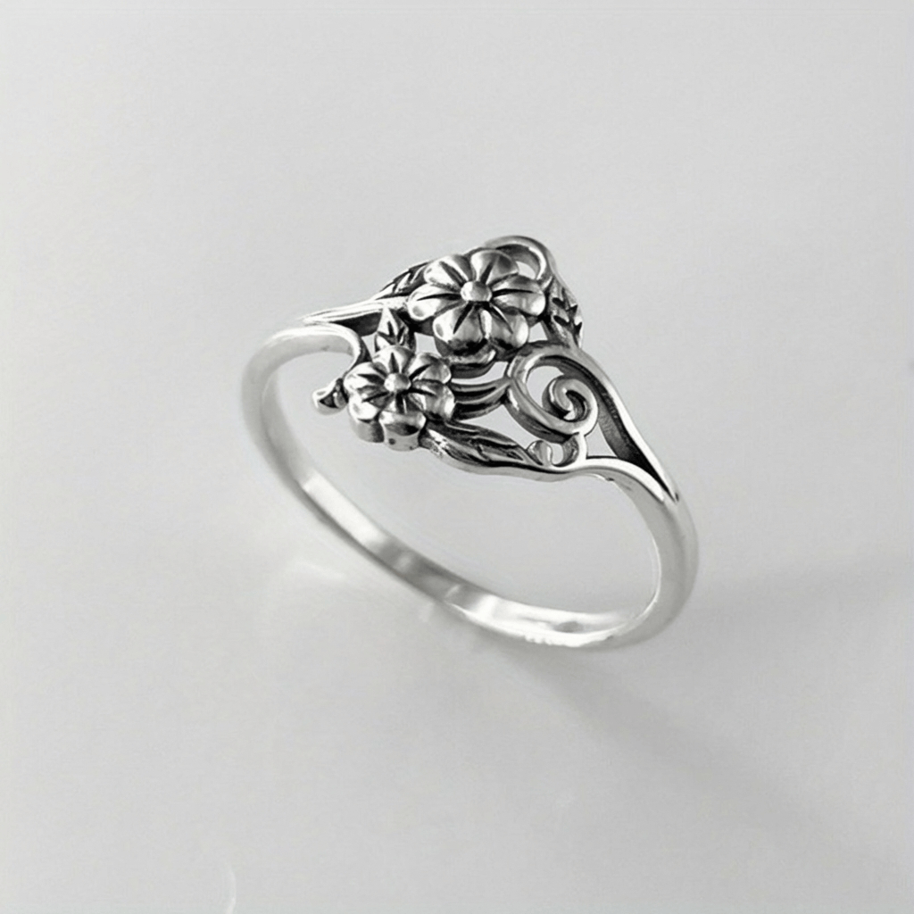 ANELLO ORNATO CON FIORI D'ARGENTO