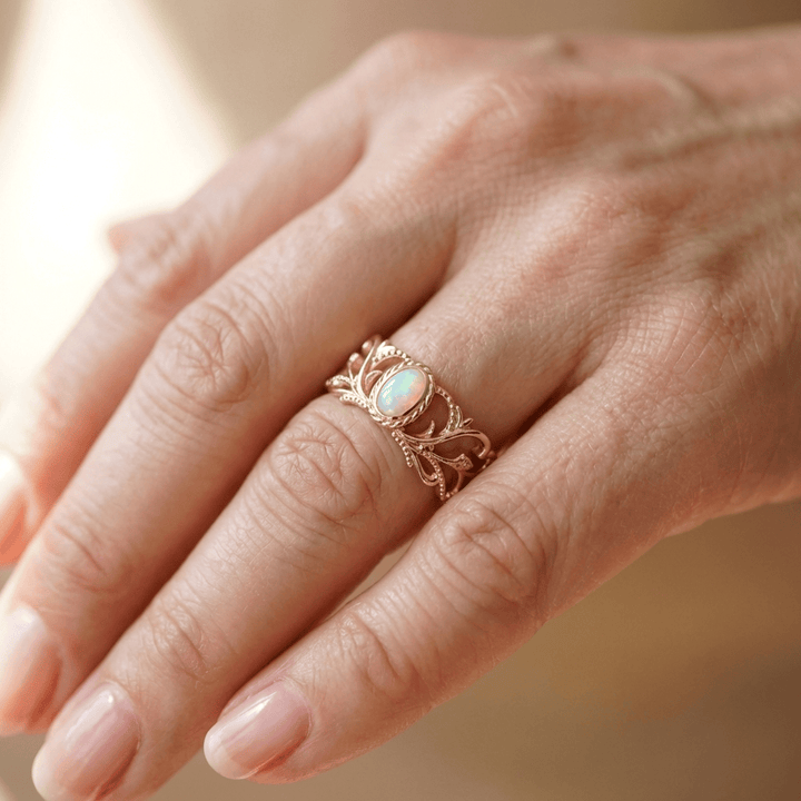 ANELLO CON ALI CELESTIALI IN OPALLO ROSA - (REGOLABILE)