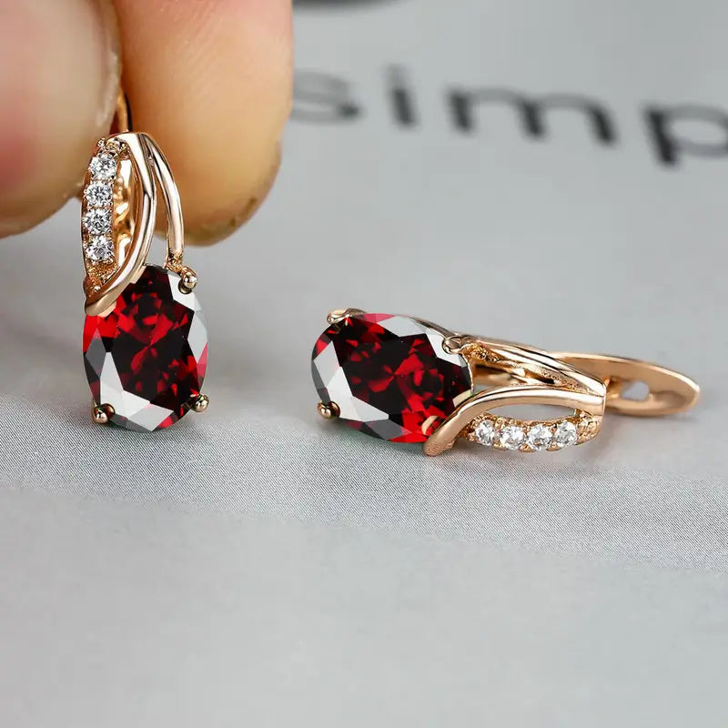 Orecchini a Goccia Twist color oro e Pietra Rossa