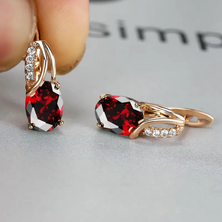 Orecchini a Goccia Twist color oro e Pietra Rossa