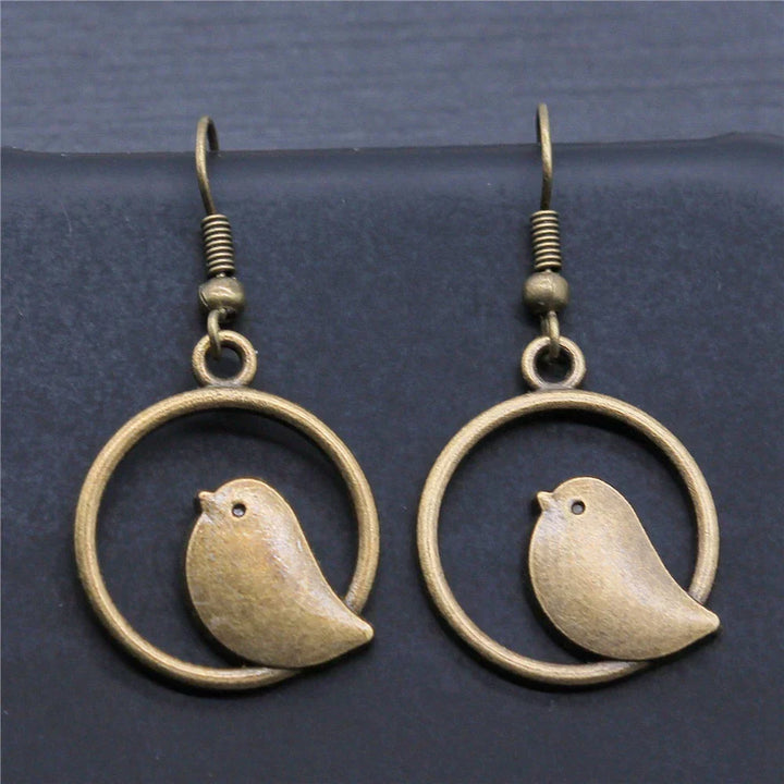Orecchini a pendente con charm di uccello vintage – Gioielli boho fatti a mano