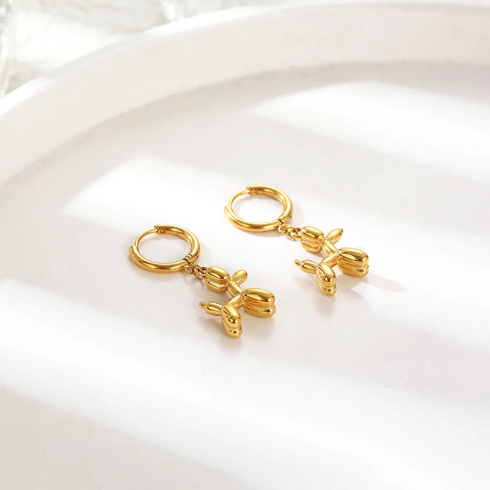 Orecchini Huggie color oro con Charm Mini Cagnolino