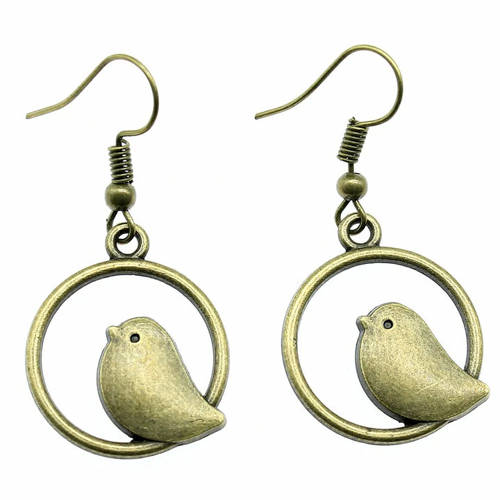 Orecchini a pendente con charm di uccello vintage – Gioielli boho fatti a mano