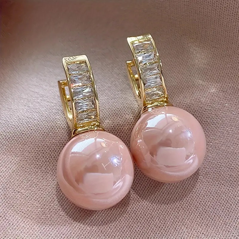 Orecchini color oro con Zirconia Rosa