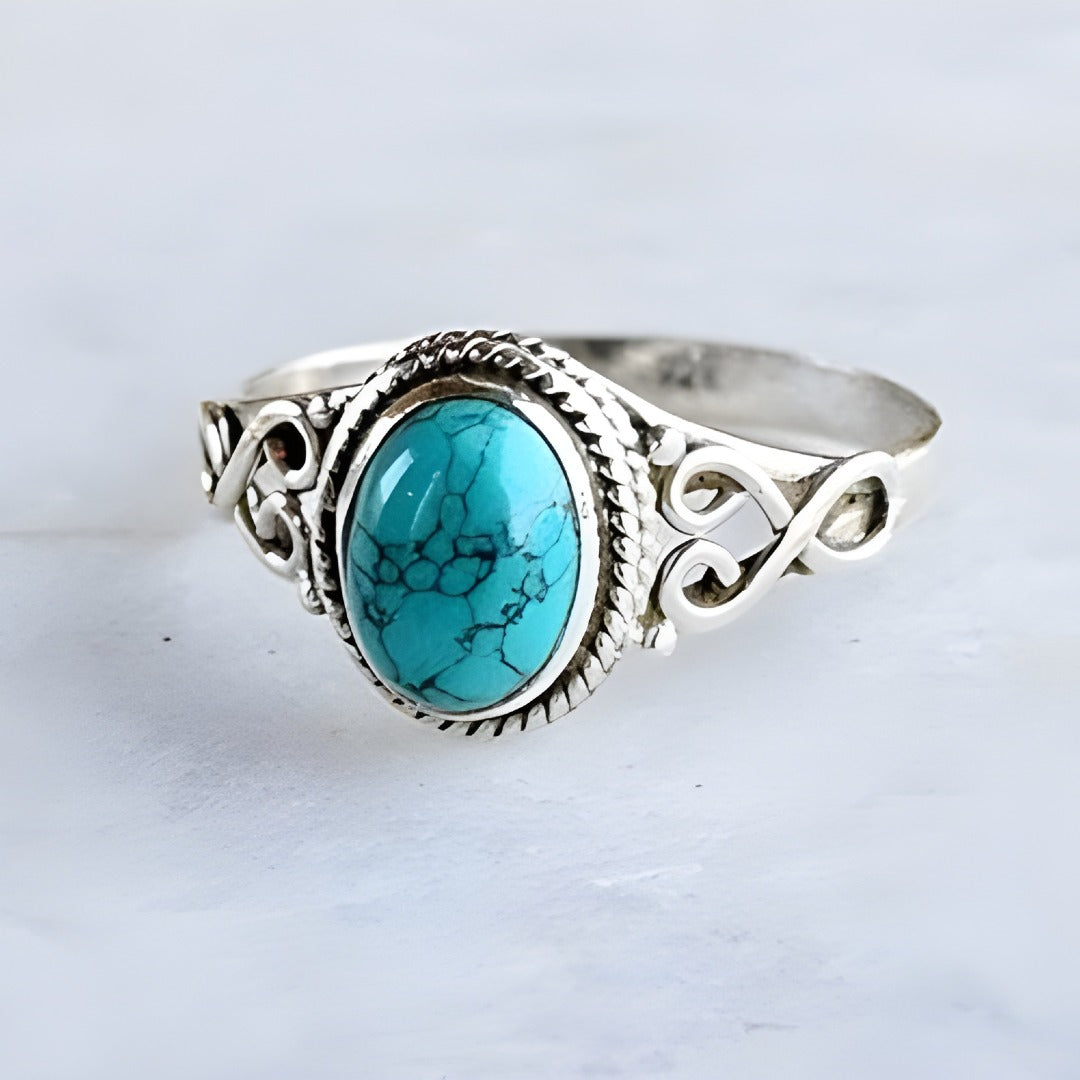 Anello Ovale color argento con Turchese Senza Tempo